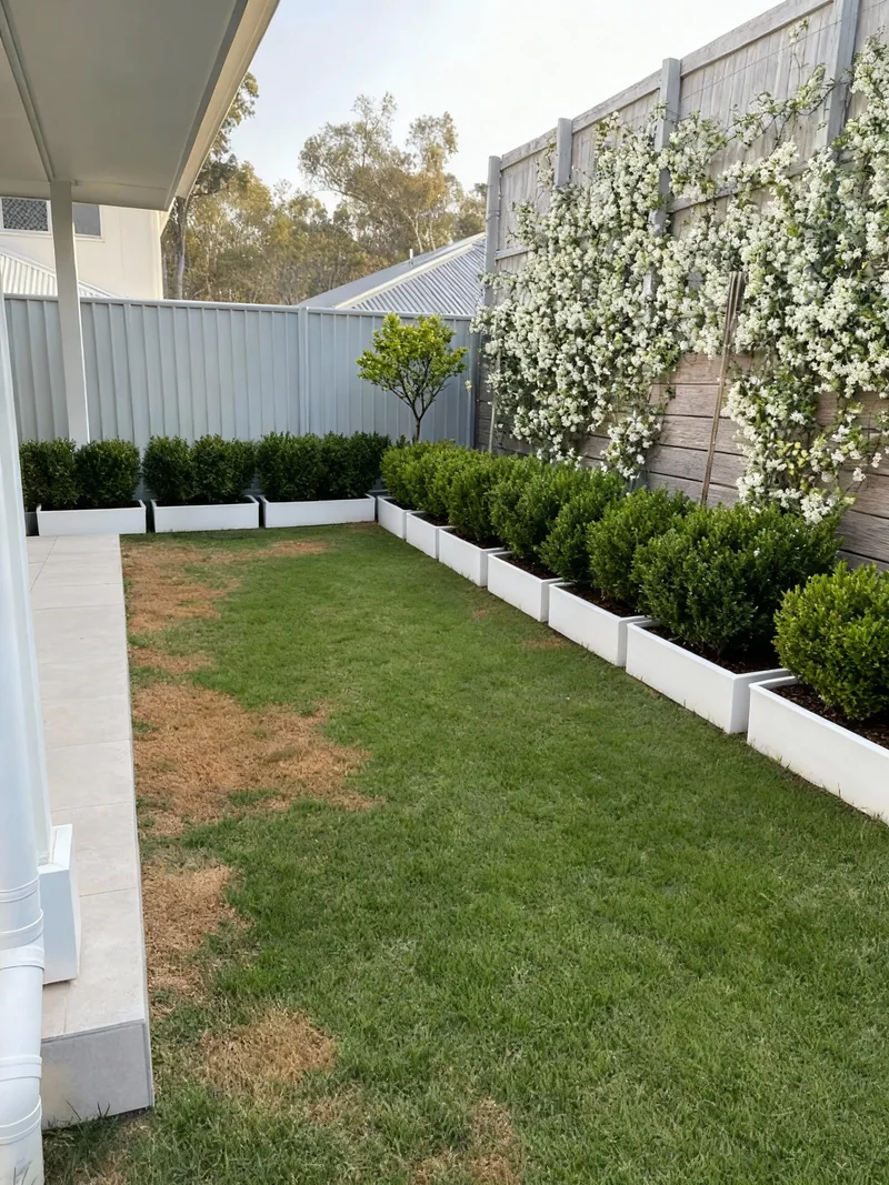 Redesign the garden space in image 1, using style reference image 2's plants